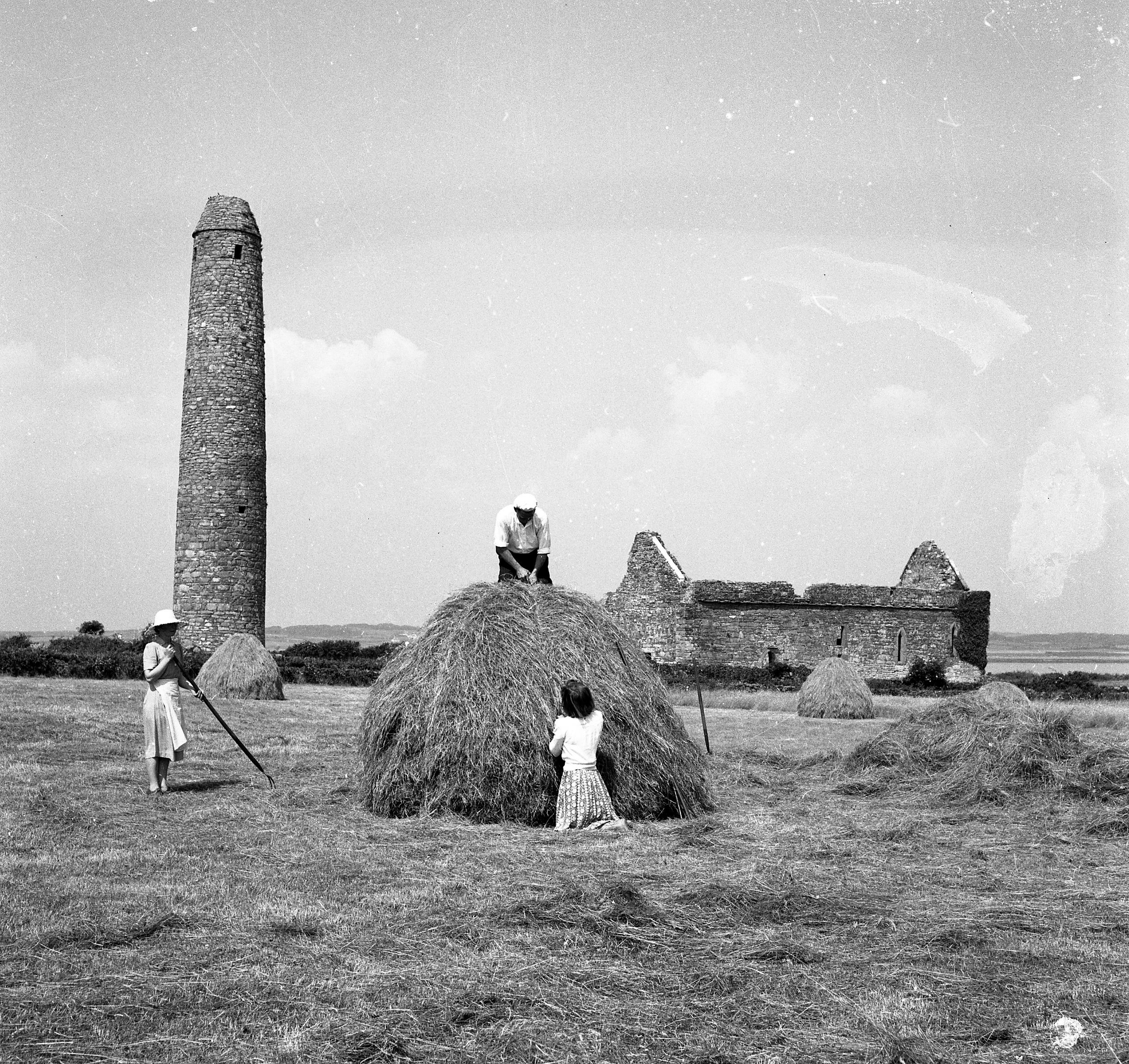Islanders working taking in the hay in a field on Scattery Island